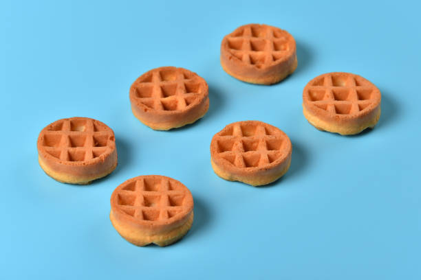 istock Soft Viennese waffles on a blue background 1217324813