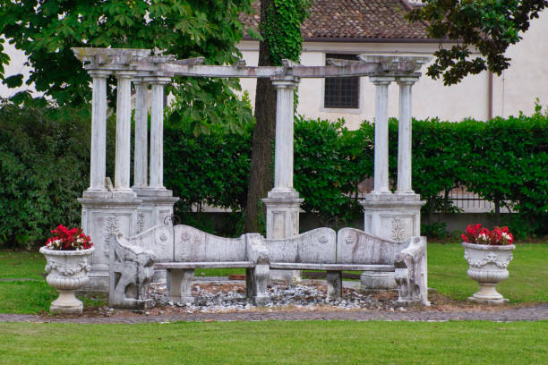 istock Pavilion in garden, stone ancient arbor in Italy 1217326170