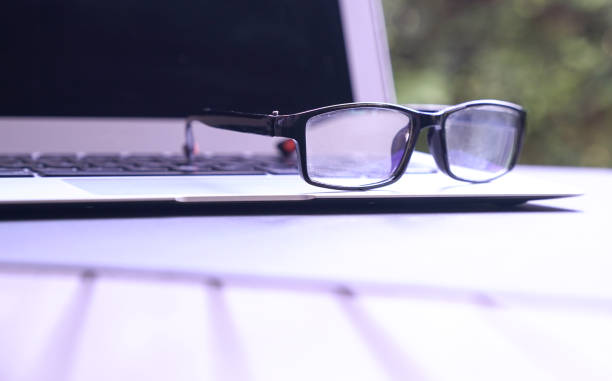 istock Spectacles on top of computer laptop. Copy space. 1217326328