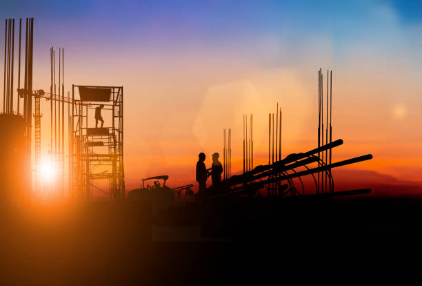 istock Silhouette Engineer and construction team working at site over blurred  industry background with Light fair Film Grain effect.Create from multiple reference images together 1217326563