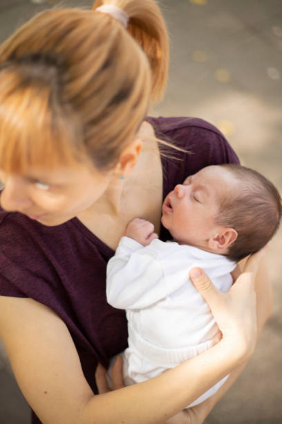 istock Young mother enjoying outdoors with her newborn boy 1217326892