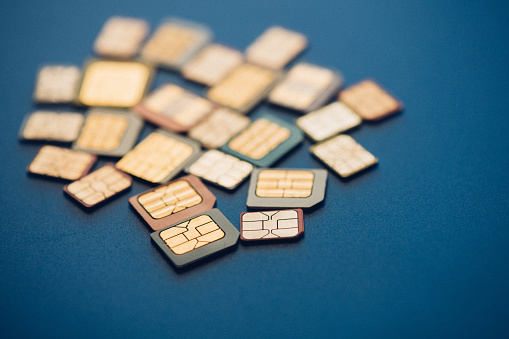 Image of Many sim cards on blue background.