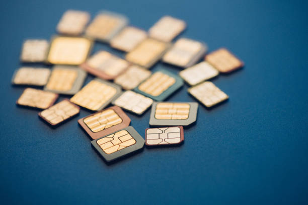 Many different sim cards on blue background Image of Many sim cards on blue background. sim cards stock pictures, royalty-free photos & images