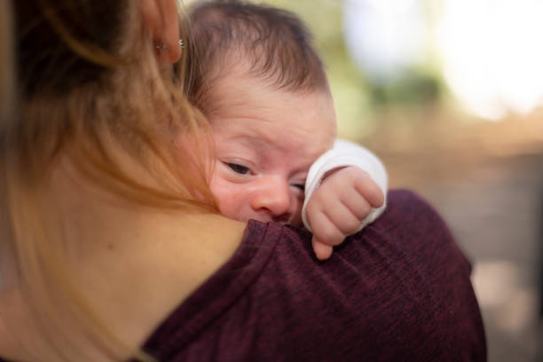istock Newborn baby in mom's arms 1217327676