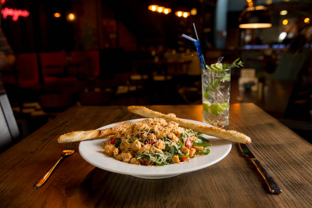 istock Chicken salad with rocket, cherry tomatoes, smoked cheese and crunchy sesame sticks 1217328525