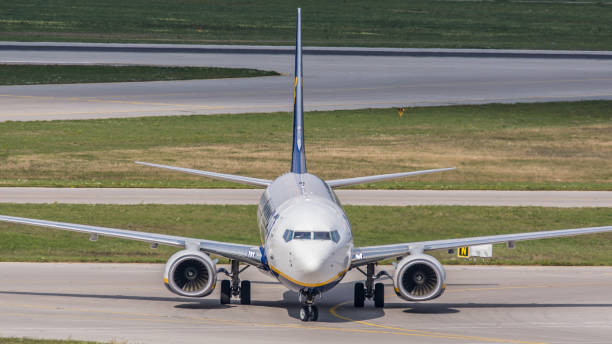 Boeing 737 Ryanair lands at Munich Airport. Munich, Germany - September 14, 2019: A Boeing 736-8AS (Boeing 737 NG / MAX) from Ryanair lands at Munich Airport. The aircraft has been in service for the Irish airline since January 2017. munich airport stock pictures, royalty-free photos & images