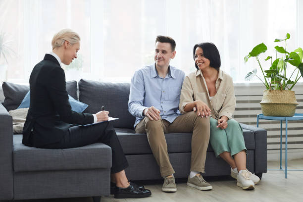 istock Real Estate Agent concluding the contract with couple 1217331065