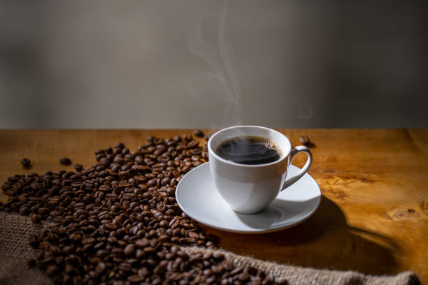 istock Cup of coffee and coffee beans on burlap sack. 1217331152
