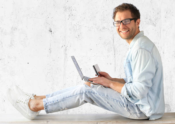 istock Young man with a laptop 1217331460