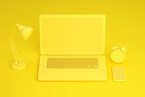 istock Empty Screen Smartphone and Laptop on Yellow Background 1217332966