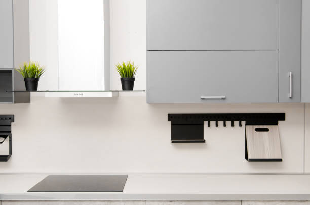 modern kitchen in scandinavian style with hob, fume hood and countertop modern kitchen in scandinavian style with hob, fume hood and countertop. fume cupboard stock pictures, royalty-free photos & images