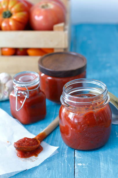 istock tasty tomatoes on blue wooden table 1217339005