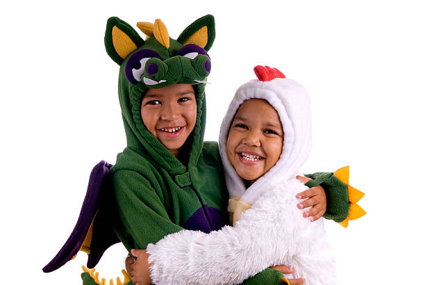 Two children, in halloween costumes, giving each other a hug.\n\n[url=http://bit.ly/sSWKfS][img]http://nicolesyoung.com/istock/lightboxes/halloween.png[/img][/url]\n[url=http://bit.ly/sQ2o2Q][img]http://nicolesyoung.com/istock/lightboxes/arayaprince.png[/img][/url]\n[url=http://bit.ly/sbl0UN][img]http://nicolesyoung.com/istock/lightboxes/happychildren.png[/img][/url]\n[url=http://bit.ly/tpTBhL][img]http://nicolesyoung.com/istock/lightboxes/whitebackground.png[/img][/url]