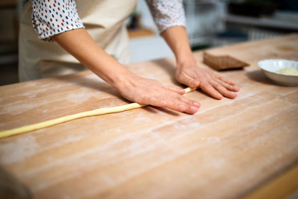 istock Woman chef preparing gnocchi pasta 1217341598