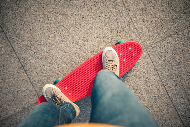 istock Skateboarder legs skateboarding at city 1217341753
