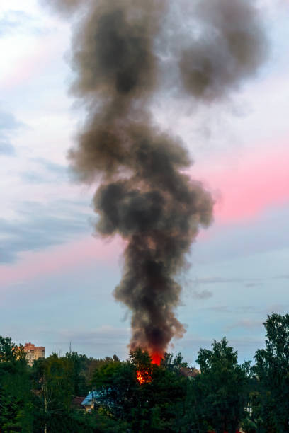 istock the building burns with fire and black smoke against the evening sky 1217342262