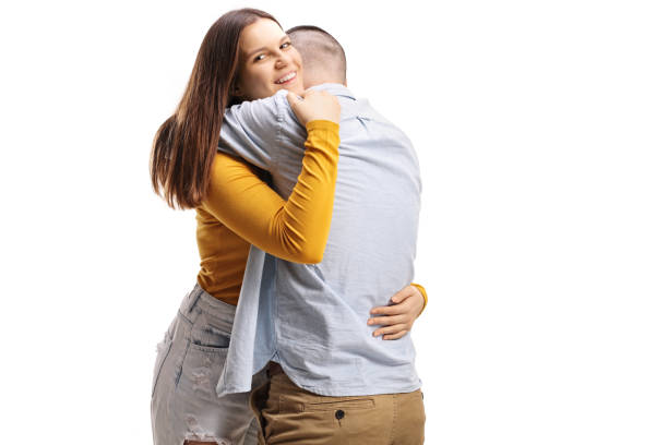 istock Young man and woman hugging each other 1217342364