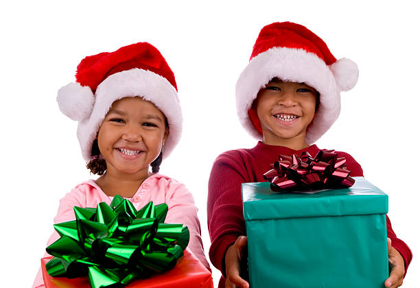 Menino e Menina com Natal apresenta - fotografia de stock