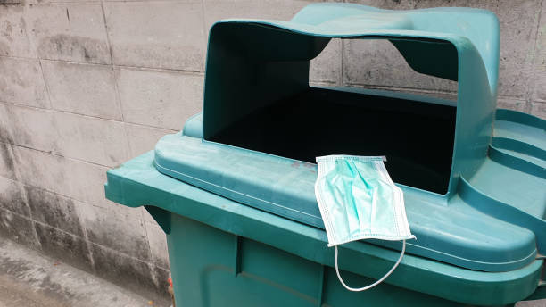 istock surgical mask waste bin dirty virus bacteria covid-19 contagious diseases 1217344384