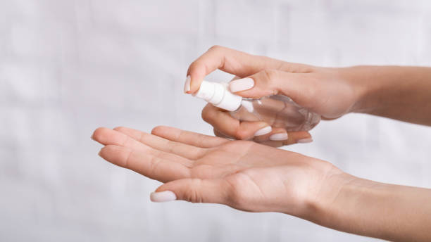 istock Protection from coronavirus. Woman sprays antiseptics on her hands. 1217346470