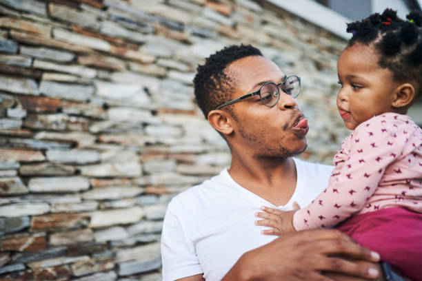 istock Dad, if you make faces like that it'll get stuck 1217348643
