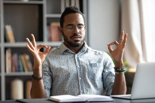 istock African American man practice yoga at workplace 1217351024
