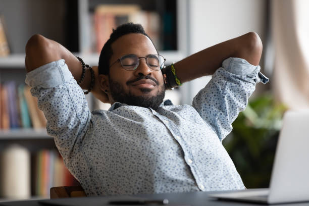 istock Happy biracial male employee relax at workplace 1217351044