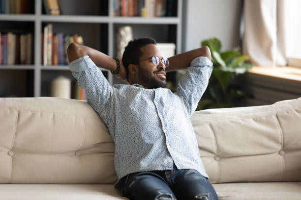 istock Happy biracial man look in distance visualizing 1217351075