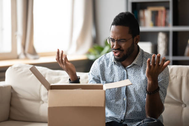istock Frustrated biracial man disappointed with internet order 1217351083