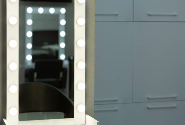 istock Reflection in mirror with light at hairdresser 1217353619