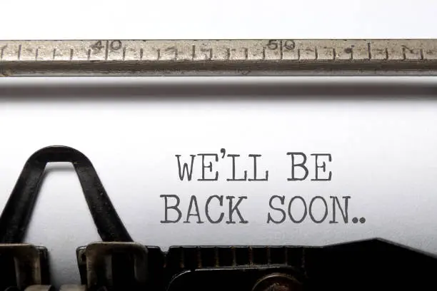 We'll be back soon typewriter headline closeup
