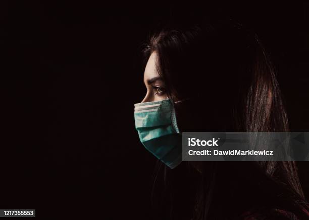 Beautiful Woman In A Blue Mask Stock Photo - Download Image Now - Protective Face Mask, Pandemic - Illness, COVID-19