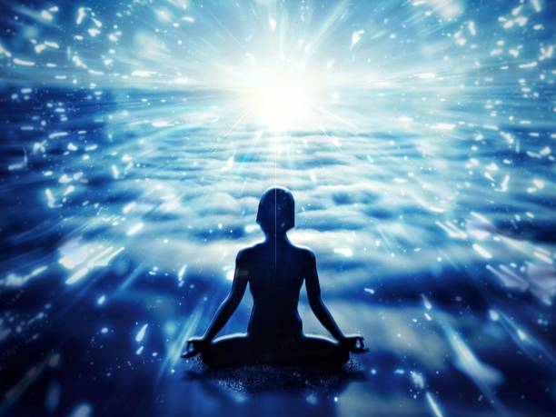istock Silhouette of a person meditating 1217357867