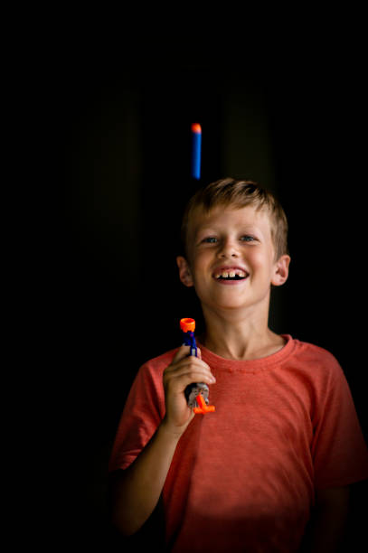 istock Boy with a toy gun portrait 1217358515