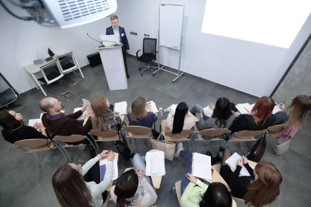 istock rear view.the project Manager conducts a meeting 1217359570