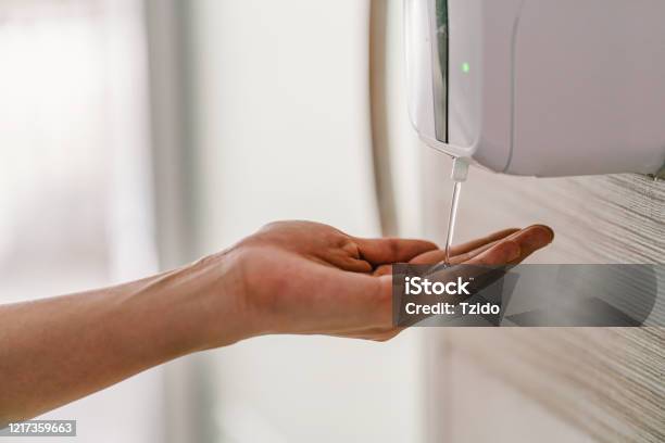 Closeup Asian Woman Hand Using Wash Hand Sanitizer Gel Dispenser Automatic Machine Stock Photo - Download Image Now