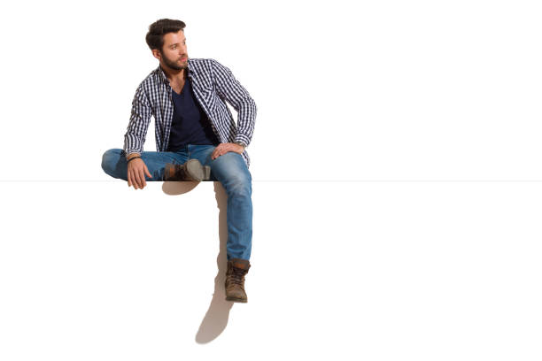 istock Handsome Man Is Sitting Relaxed On A Top And Looking At The Side 1217361906