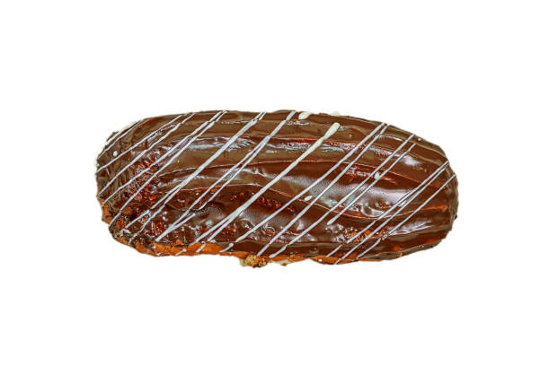 istock Eclair with chocolate icing. Fresh pastries. Closeup on a light background. Delicious and healthy range of bakery and bakery. Isolate the view from the top 1217362007