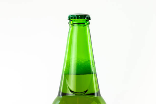 istock top part of green beer bottle on white background. 1217362012