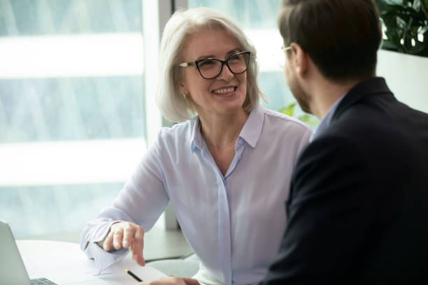 istock Smiling coworkers have fun brainstorming at meeting 1217363248