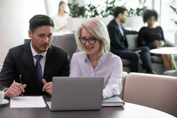 istock Diverse businesspeople discuss company project in office 1217363277