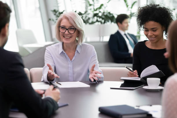istock Diverse multiethnic businesspeople discuss paperwork at meeting 1217363334