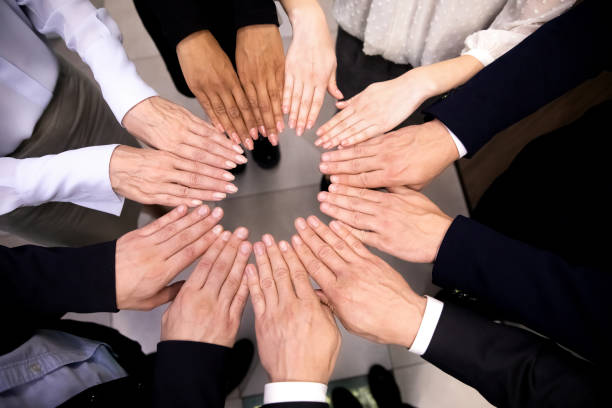 istock Close up of diverse employees engaged in teambuilding activity 1217363352