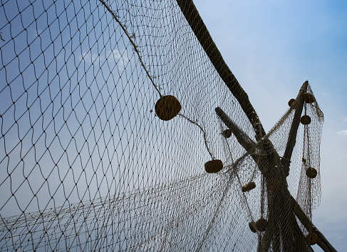 Background image of a fishing net.