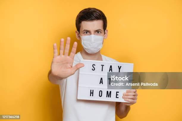 Gue Showing Stop Gesture And Stay Home Text As Social Media Campaign For Coronavirus Prevention Stock Photo - Download Image Now