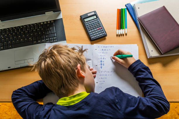 istock frustrated teenager doing homework 1217368094