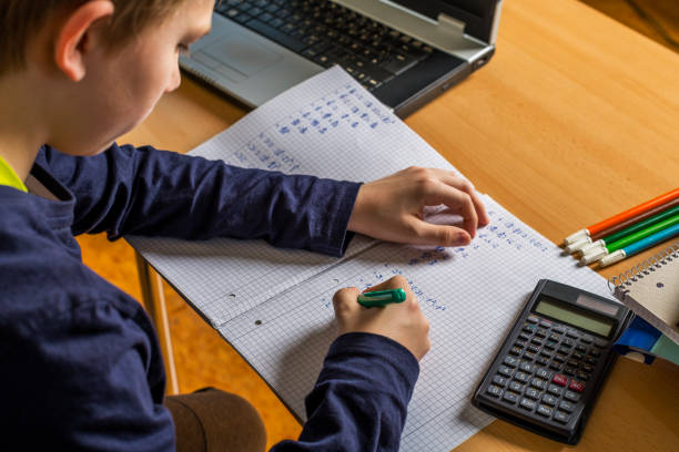 istock teenager doing homework 1217368259