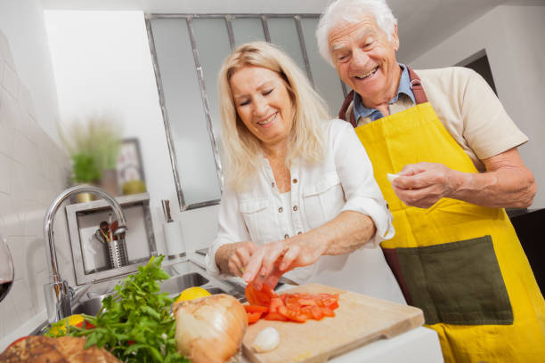 istock Senior couple cooking in a kitchen 1217368717