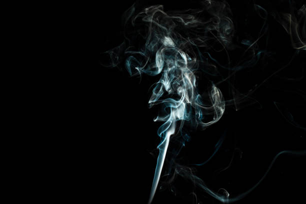 istock puffs of white smoke with a black background 1217369260
