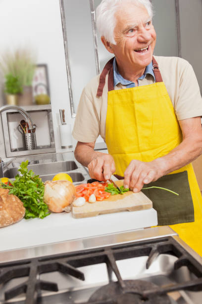 istock Senior man in a kitchen at home. 1217369949
